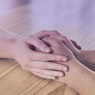 Reassuring hands of counseling staff with student